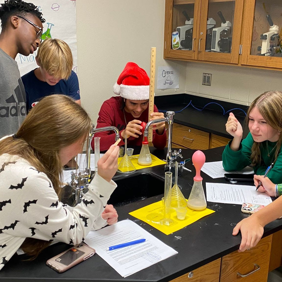 8th graders exploring respiration of yeast and Carbon dioxide.